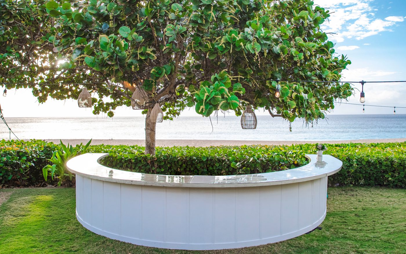 White semi-circle bar at an outdoor garden event